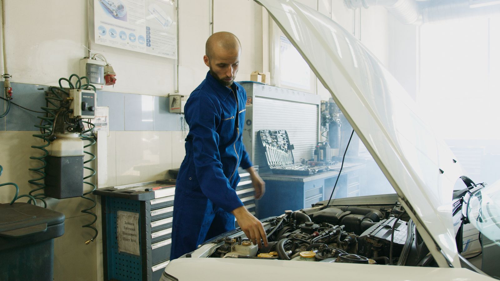 Auto electrician checking a car